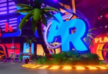 Anime Reborn Update 1 Codes Feature image for our Anime Reborn Update 1 Codes guide. Image shows a blue sign that says 'AR' near a palm tree.