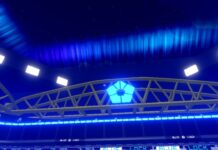 Blue Lock Rivals Techniques Guide Feature image for our Blue Lock Rivals Techniques guide. Image shows the top of a football stadium with blue lights in the sky.