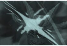 Ghoul RE Quinque Tier List Feature image for our ghoul re quinque tier list showing a white monster behind light shines with glaring teeth looking toward the viewer