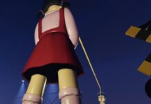 Ink Game Last Dinner – How To Get The Secret Minigame and Win! Feature image for our Ink Game Last Dinner guide. Image shows a large doll holding a jumping rope.