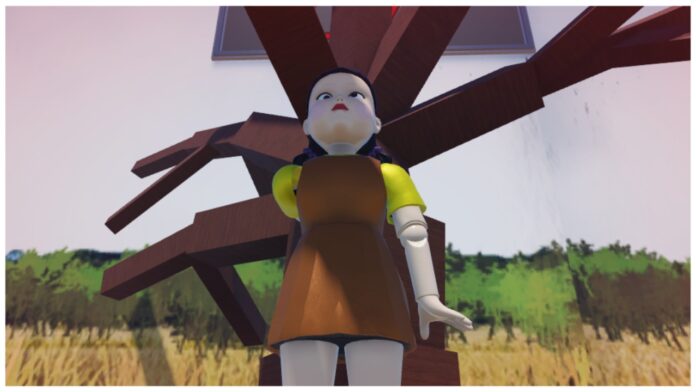 Feature image for our how to kill in ink game guide showing the red light green light robotic doll facing the sand
